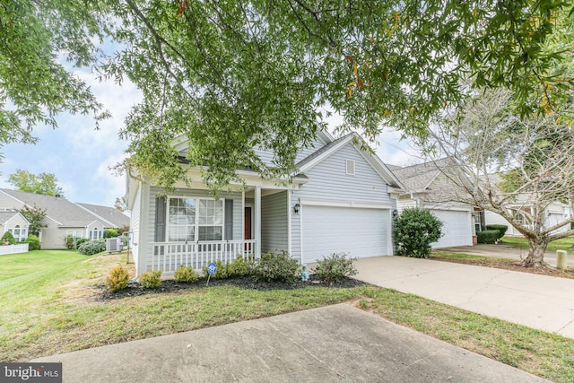 view of front of property with a porch, a garage, and a front yard