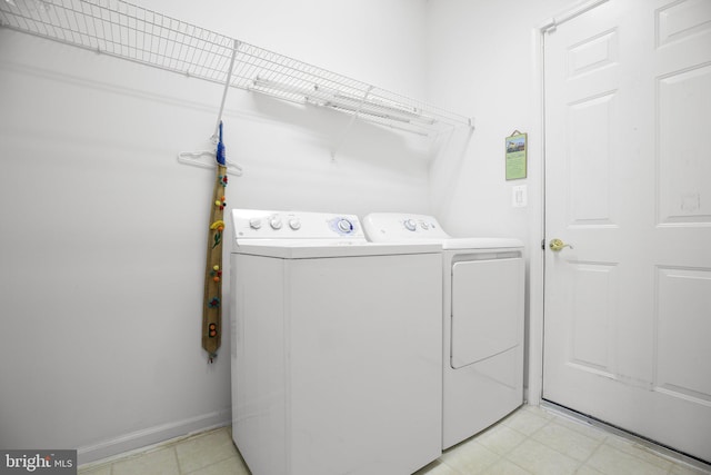 laundry area featuring washing machine and clothes dryer