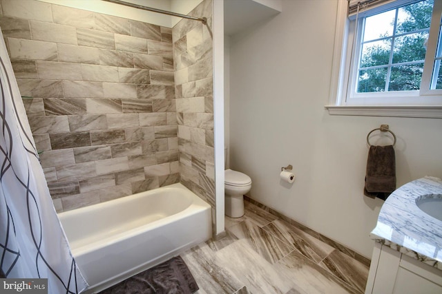 full bathroom with vanity, toilet, and shower / bath combo with shower curtain