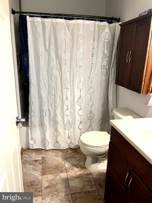 full bathroom with vanity, toilet, and shower / bathtub combination with curtain