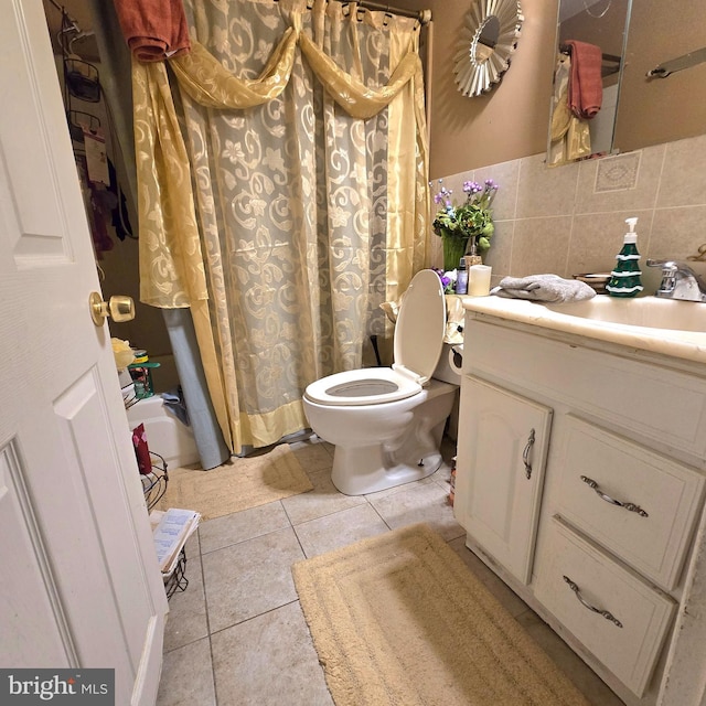 bathroom featuring tile patterned floors, a shower with curtain, decorative backsplash, tile walls, and toilet