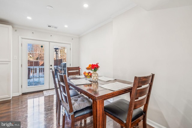 dining room featuring crown molding and french doors