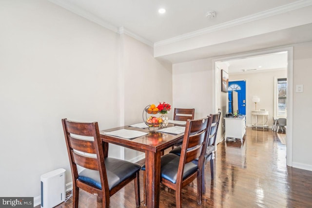 dining space with crown molding