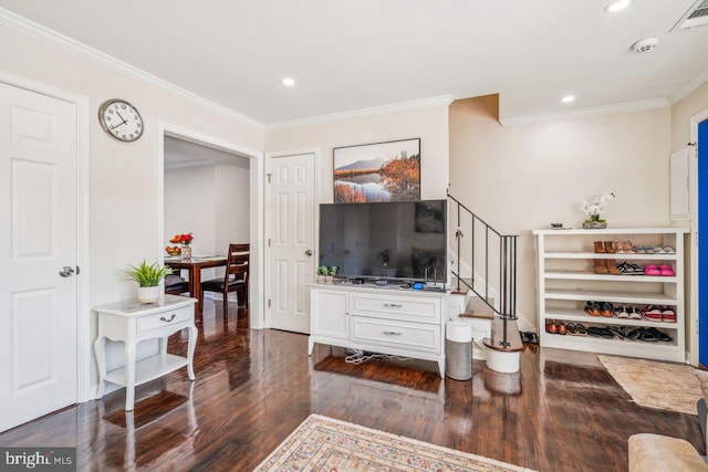 living room with crown molding and dark wood-type flooring