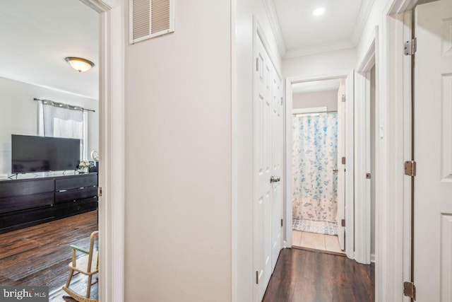 hall with crown molding and dark hardwood / wood-style floors