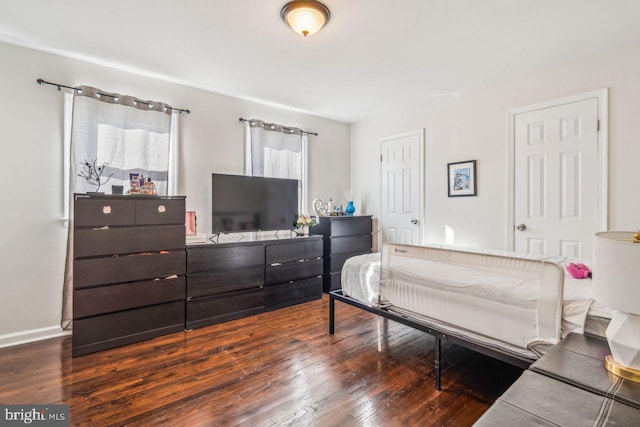 bedroom featuring dark wood-type flooring