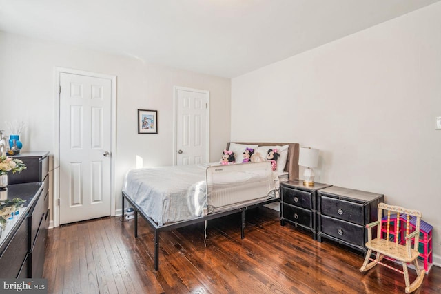 bedroom featuring dark wood-type flooring