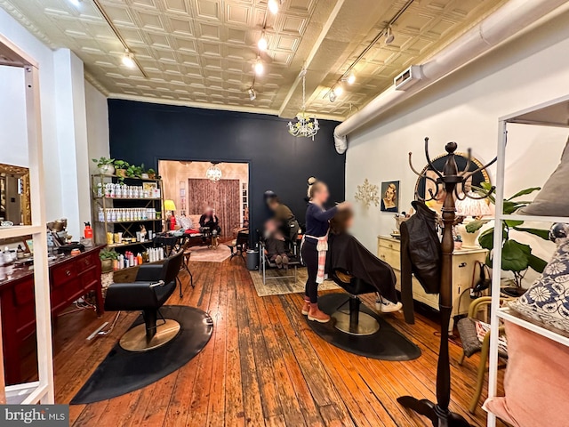 workout room with wood-type flooring