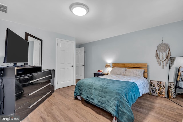 bedroom with light hardwood / wood-style floors