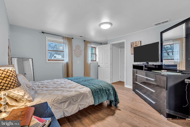 bedroom with light hardwood / wood-style floors