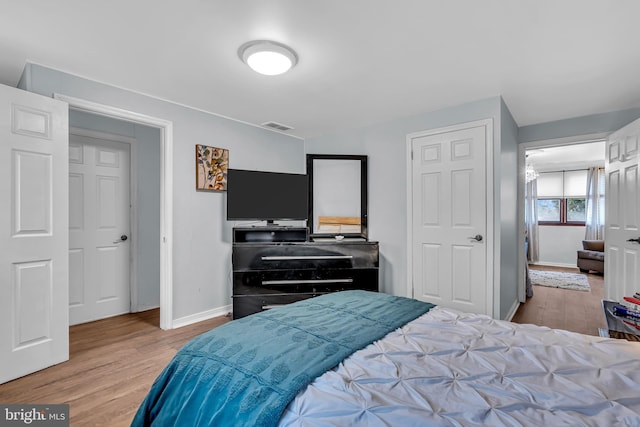 bedroom with light hardwood / wood-style floors