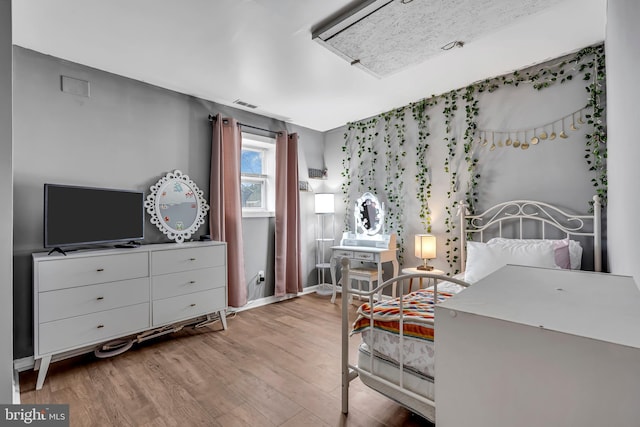 bedroom featuring light hardwood / wood-style flooring