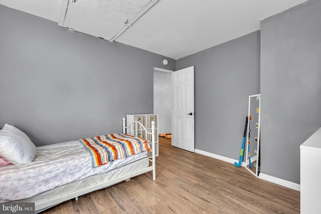 bedroom featuring hardwood / wood-style floors