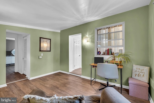 home office with hardwood / wood-style flooring