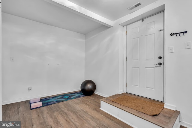 workout area featuring hardwood / wood-style flooring