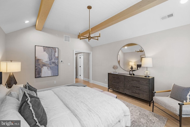 bedroom featuring light hardwood / wood-style flooring and vaulted ceiling with beams