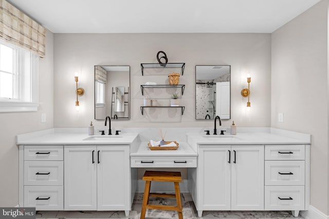 bathroom featuring walk in shower and vanity