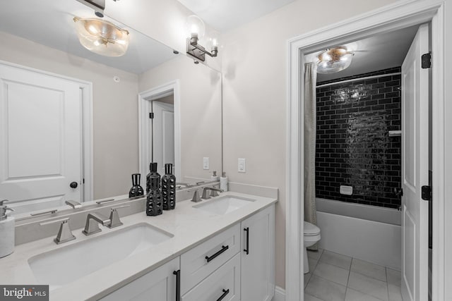 full bathroom with tile patterned flooring, vanity, shower / bathtub combination with curtain, and toilet