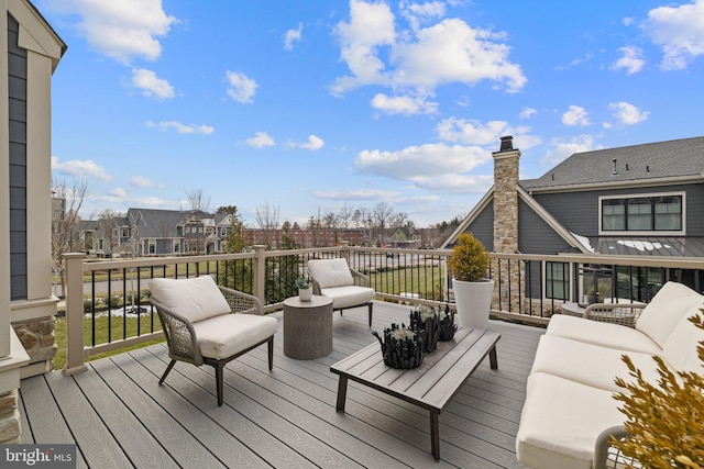 wooden deck with outdoor lounge area