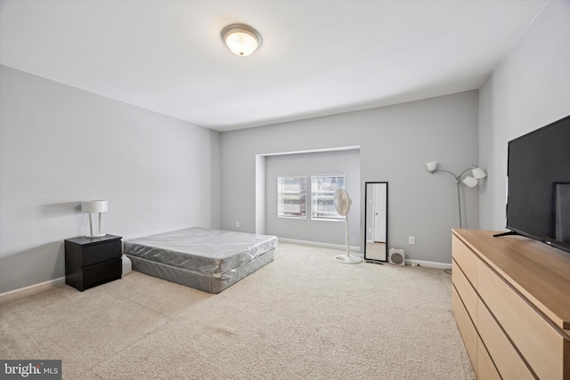 bedroom featuring carpet floors and baseboards