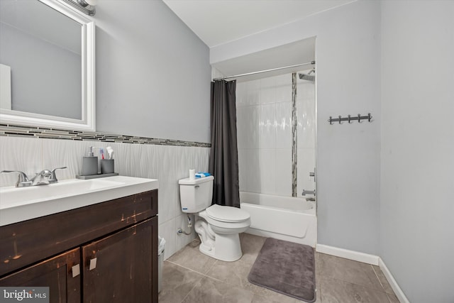 full bath featuring toilet, shower / tub combo, vanity, and tile patterned floors