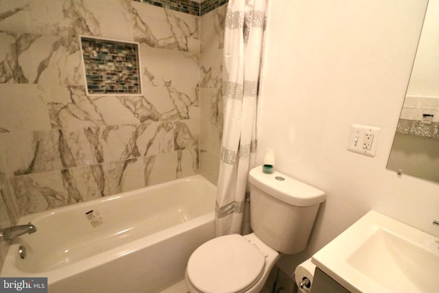 full bathroom with vanity, toilet, and shower / bath combo with shower curtain