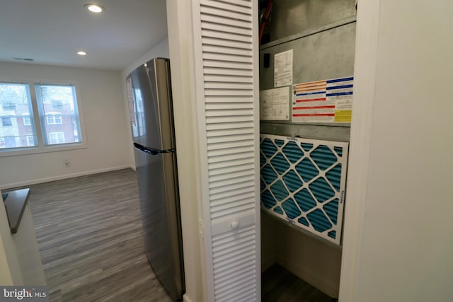 interior space featuring hardwood / wood-style flooring and stainless steel fridge