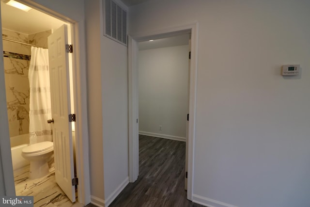 hall featuring dark wood-type flooring