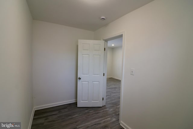 unfurnished room featuring dark hardwood / wood-style flooring