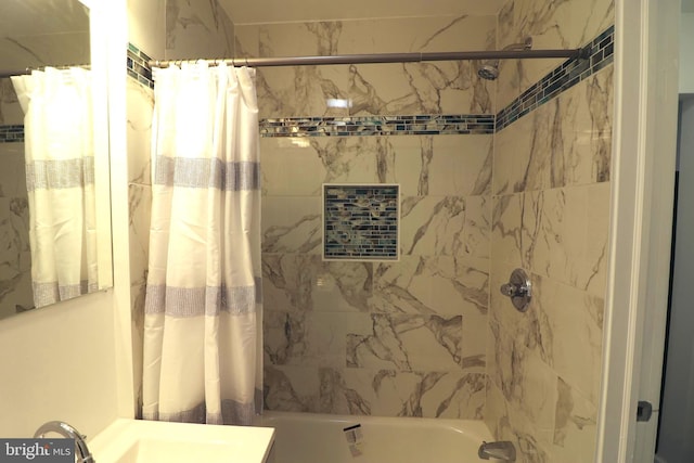 bathroom with sink and shower / tub combo with curtain