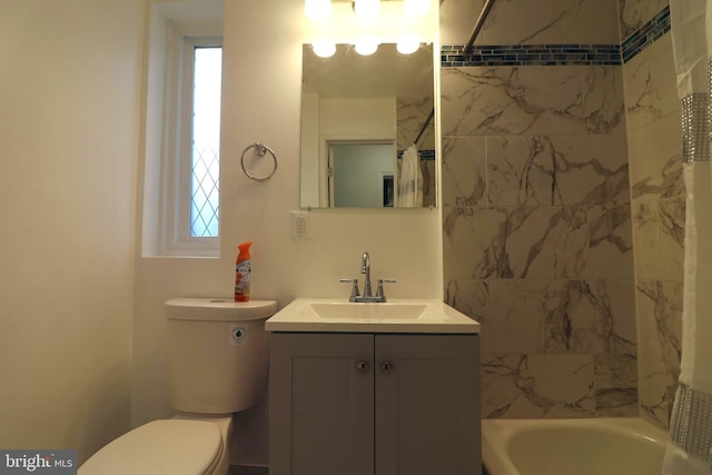 full bathroom featuring vanity, toilet, and shower / bathtub combination with curtain