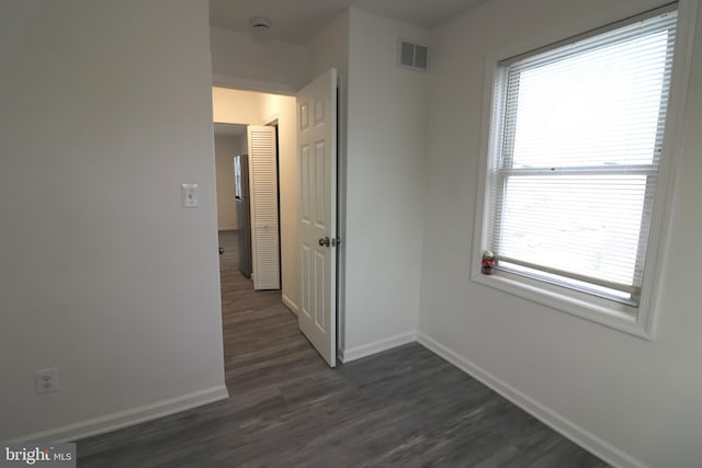 hall featuring dark wood-type flooring