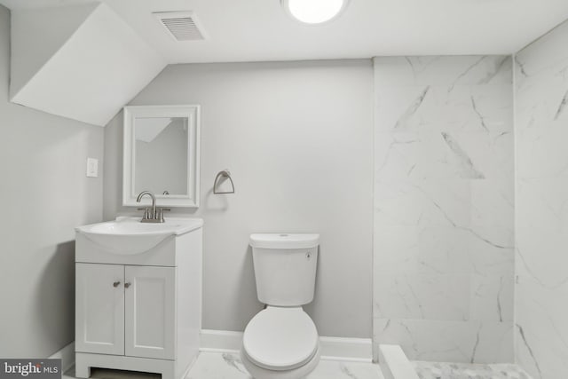 bathroom with walk in shower, vanity, and toilet