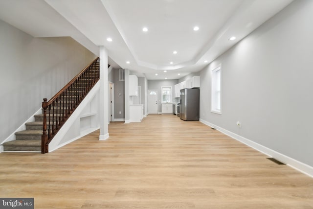 unfurnished living room featuring light wood-type flooring