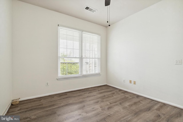 empty room with hardwood / wood-style flooring and ceiling fan