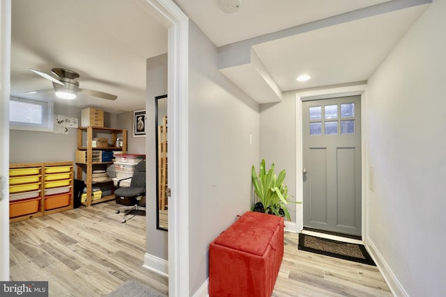 entrance foyer with a wealth of natural light, ceiling fan, and light hardwood / wood-style floors