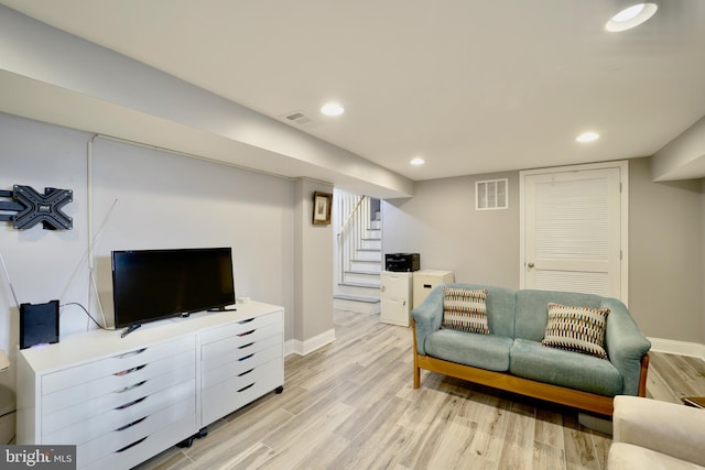 living room with light hardwood / wood-style flooring