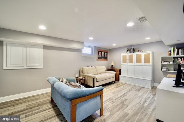 living room with light hardwood / wood-style flooring