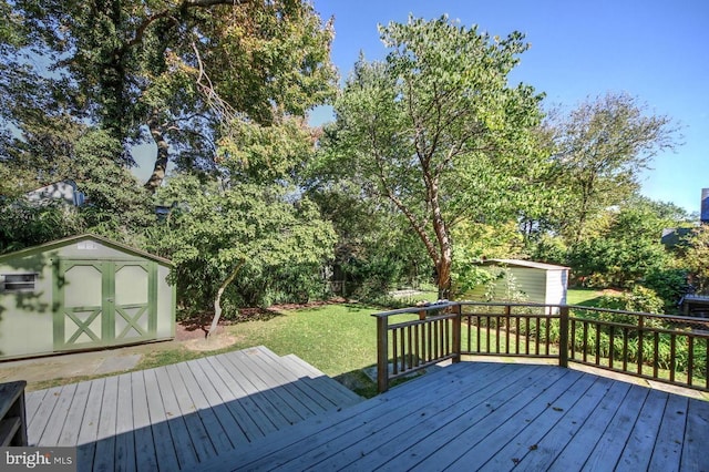 wooden deck with a lawn and a shed