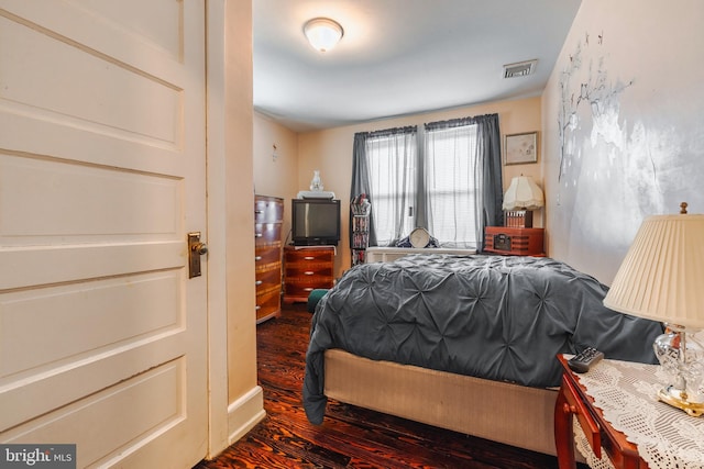 bedroom featuring dark wood-type flooring