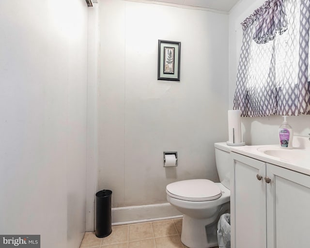 bathroom with toilet, tile patterned floors, and vanity