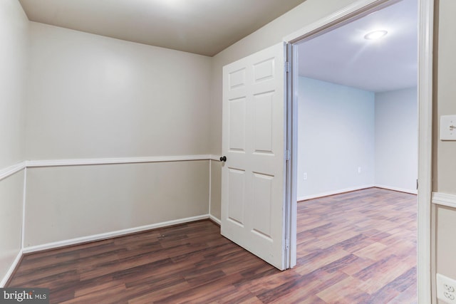 spare room featuring dark hardwood / wood-style floors