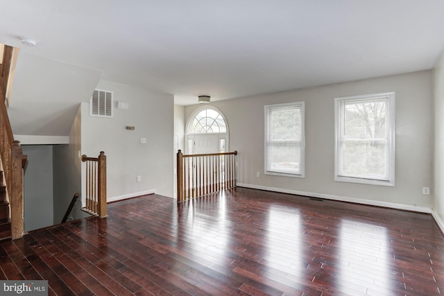 spare room featuring dark hardwood / wood-style flooring