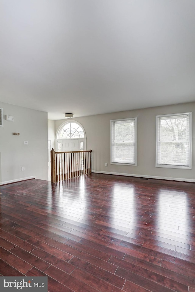 empty room featuring dark wood-type flooring