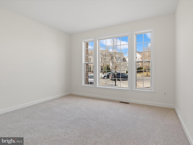 spare room with carpet flooring