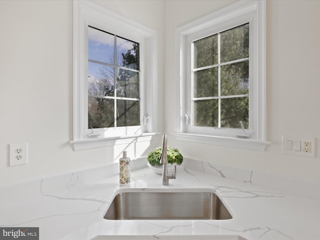 room details with sink and light stone countertops