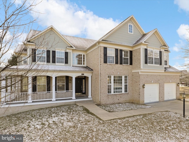 view of front facade featuring a garage and covered porch