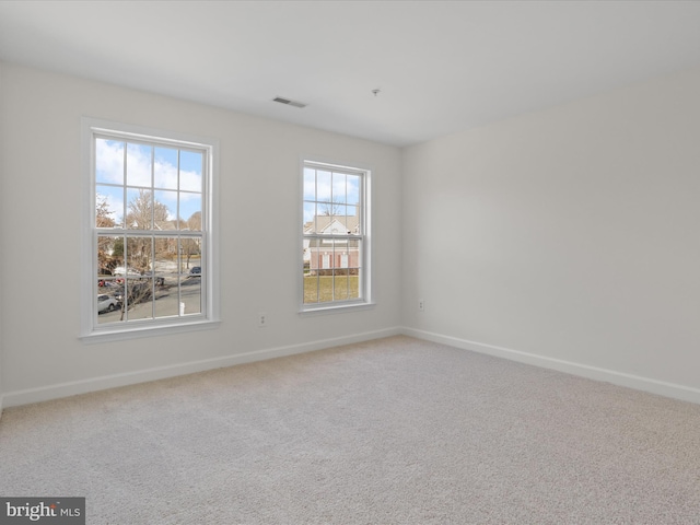 unfurnished room with carpet floors