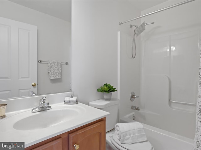 full bathroom with toilet, vanity, and shower / tub combination