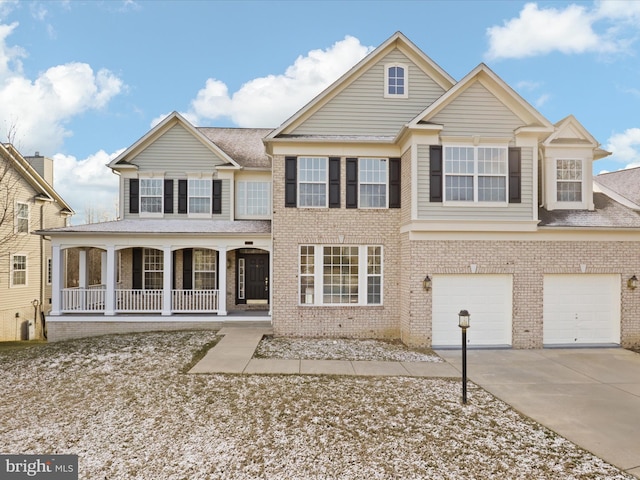 view of front of house featuring a porch and a garage